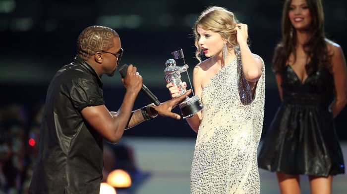 At the 2009 VMAs, Kanye West was the "surprise factor" who appeared on stage and sabotaged Taylor Swift's acceptance speech.